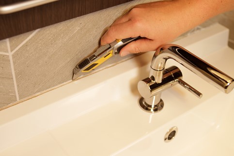 score the caulk